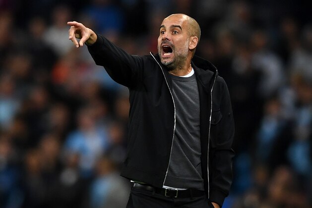 MANCHESTER, ENGLAND - OCTOBER 17:  Josep Guardiola, Manager of Manchester City gives his team instructions during the UEFA Champions League group F match between Manchester City and SSC Napoli at Etihad Stadium on October 17, 2017 in Manchester, United Kingdom.  (Photo by Gareth Copley/Getty Images)