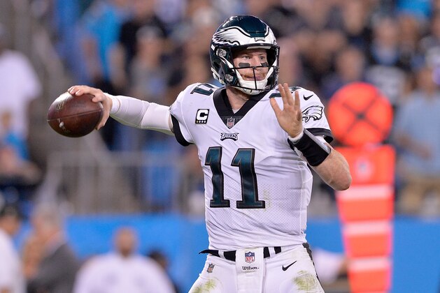 CHARLOTTE, NC - OCTOBER 12:  Carson Wentz #11 of the Philadelphia Eagles looks to pass against the Carolina Panthers during their game at Bank of America Stadium on October 12, 2017 in Charlotte, North Carolina.  (Photo by Grant Halverson/Getty Images)
