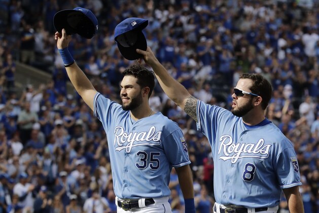 Veteran Kansas City Royals players Eric Hosmer (35) and Mike Moustakas (8) acknowledge the crowd as they come out of the game during the fifth inning of a baseball game against the Arizona Diamondbacks Sunday, Oct. 1, 2017, in Kansas City, Mo. (AP Photo/Charlie Riedel)
