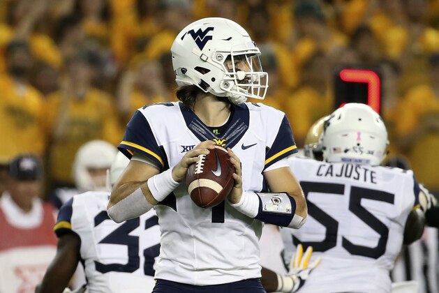 West Virginia quarterback Will Grier (7) drops back against Baylor in the first half of an NCAA college football game, Saturday, Oct. 21, 2017, in Waco, Texas. (AP Photo/Jerry Larson)