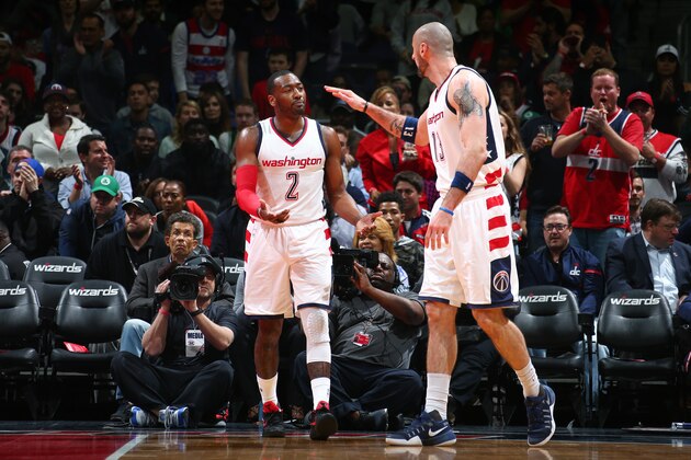 WASHINGTON, DC -  MAY 12: John Wall #2 and Marcin Gortat #13 of the Washington Wizards high five each other during the game against the Boston Celtics during Game Six of the Eastern Conference Semifinals of the 2017 NBA Playoffs on May 12, 2017 at Verizon Center in Washington, DC. NOTE TO USER: User expressly acknowledges and agrees that, by downloading and or using this Photograph, user is consenting to the terms and conditions of the Getty Images License Agreement. Mandatory Copyright Notice: Copyright 2017 NBAE (Photo by Ned Dishman/NBAE via Getty Images)