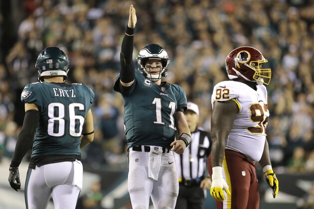 Philadelphia Eagles quarterback Carson Wentz (11) gestures after scrambling for yardage against the Washington Redskins during the second half of an NFL football game, Monday, Oct. 23, 2017, in Philadelphia. (AP Photo/Michael Perez)