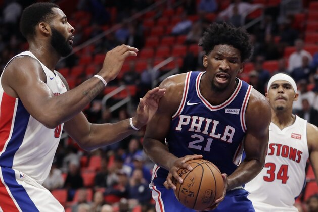 Philadelphia 76ers center Joel Embiid (21) is defended by Detroit Pistons center Andre Drummond (0) during the second half of an NBA basketball game, Monday, Oct. 23,2017, in Detroit. (AP Photo/Carlos Osorio)