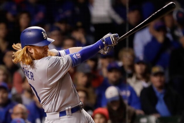 CHICAGO, IL - OCTOBER 19:  Justin Turner #10 of the Los Angeles Dodgers hits a single in the third inning against the Chicago Cubs during game five of the National League Championship Series at Wrigley Field on October 19, 2017 in Chicago, Illinois.  (Photo by Jamie Squire/Getty Images)