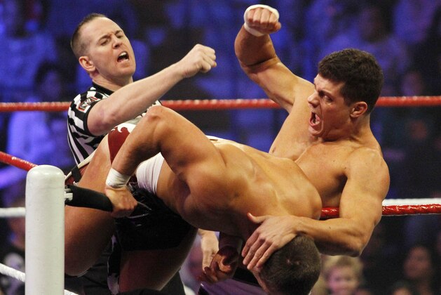 Cody Rhodes,right, and Daniel Bryan peform during WWE’s 9th annual