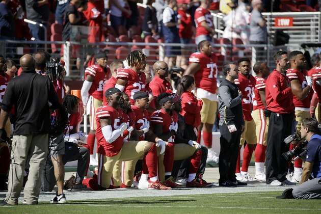 San Francisco 49ers players kneel during the performance of the national anthem before an NFL football game between the 49ers and the Dallas Cowboys in Santa Clara, Calif., Sunday, Oct. 22, 2017. (AP Photo/Eric Risberg)