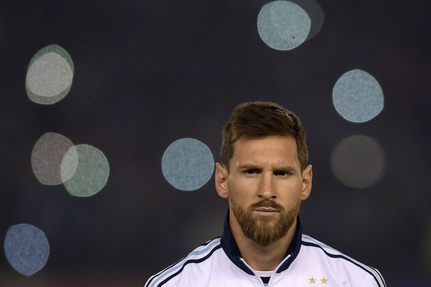 Argentina's Lionel Messi listens to the national anthems before the start of the 2018 World Cup qualifying football match between Argentina and Venezuela in Buenos Aires on September 5, 2017. / AFP PHOTO / Juan Mabromata        (Photo credit should read JUAN MABROMATA/AFP/Getty Images)