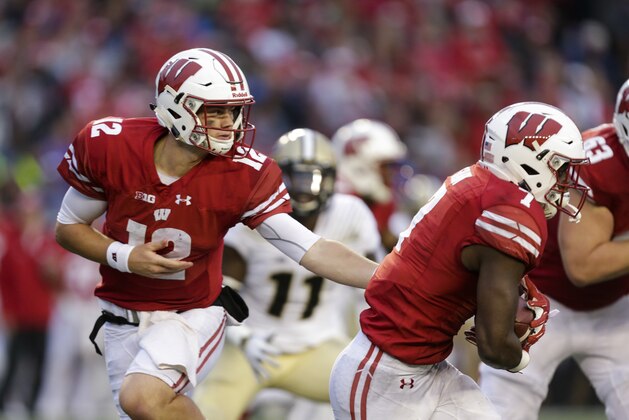 Wisconsin quarterback Alex Hornibrook and Bradrick Shaw during the second half of an NCAA college football game against Purdue Saturday, Oct. 14, 2017, in Madison, Wis. Wisconsin won 17-9. (AP Photo/Andy Manis)