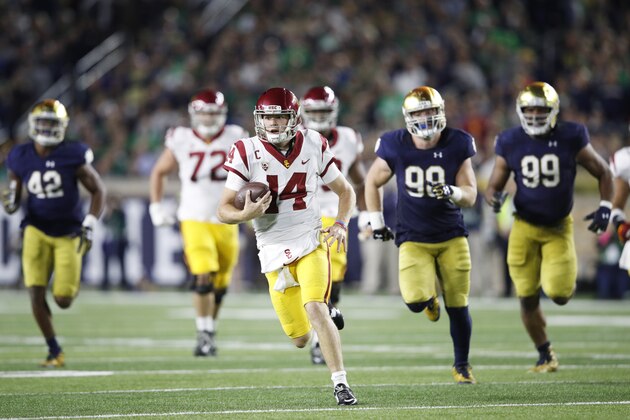SOUTH BEND, IN - OCTOBER 21: Sam Darnold #14 of the USC Trojans runs with the ball during a game against the Notre Dame Fighting Irish at Notre Dame Stadium on October 21, 2017 in South Bend, Indiana. Notre Dame won 49-14. (Photo by Joe Robbins/Getty Images)