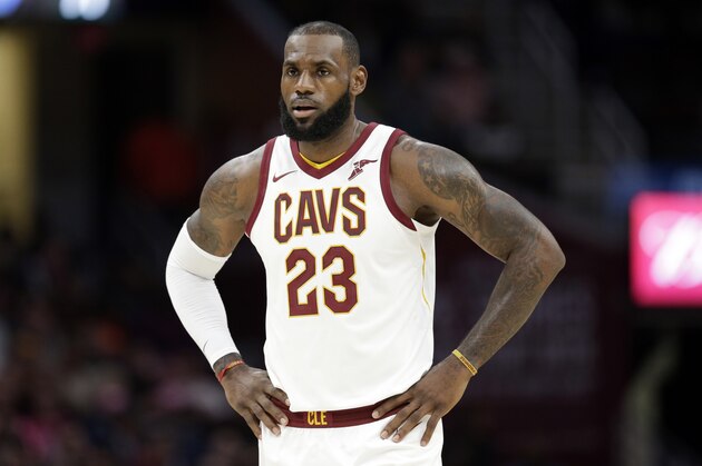 Cleveland Cavaliers' LeBron James waits for action to resume against the Orlando Magic in the first half of an NBA basketball game, Saturday, Oct. 21, 2017, in Cleveland. (AP Photo/Tony Dejak)