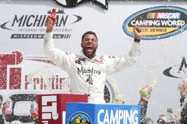 Darrell Wallace Jr., celebrates winning the NASCAR Cup Series truck race in Brooklyn, Mich., Saturday, Aug. 12, 2017. (AP Photo/Paul Sancya)