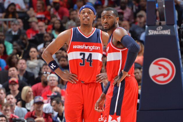 ATLANTA, GA: Paul Pierce #34 and John Wall #2 of the Washington Wizards looks on against the Atlanta Hawks in Game five of the Eastern Conference Semifinals of the NBA Playoffs on May 13, 2015 at Philips Arena in Atlanta, Georgia.  NOTE TO USER: User expressly acknowledges and agrees that, by downloading and/or using this Photograph, user is consenting to the terms and conditions of the Getty Images License Agreement. Mandatory Copyright Notice: Copyright 2015 NBAE (Photo by Jesse Garrabrant/NBAE via Getty Images)