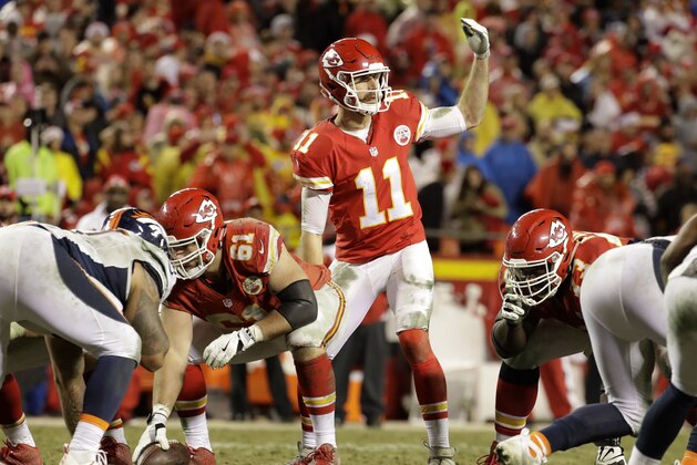 Kansas City Chiefs quarterback Alex Smith (11) gestures at the line of scrimmage during the second half of an NFL football game against the Denver Broncos in Kansas City, Mo., Sunday, Dec. 25, 2016. (AP Photo/Charlie Riedel)