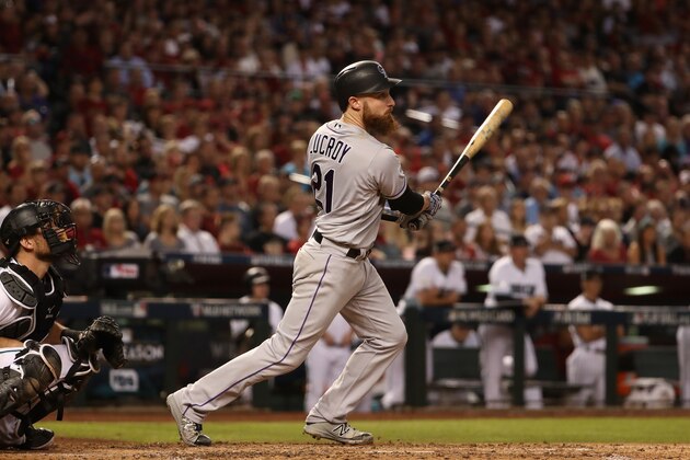 PHOENIX, AZ - OCTOBER 04:  Jonathan Lucroy #21 of the Colorado Rockies hits an RBI double during the top of the fourth inning of the National League Wild Card game against the Arizona Diamondbacks at Chase Field on October 4, 2017 in Phoenix, Arizona.  (Photo by Christian Petersen/Getty Images)