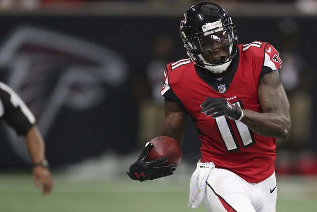 Atlanta Falcons wide receiver Julio Jones (11) runs up the sidelines against Miami Dolphins cornerback Bobby McCain (28) during the second half of an NFL football game, Sunday, Oct. 15, 2017, in Atlanta. (AP Photo/John Bazemore)
