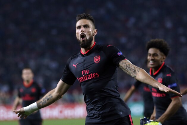 Arsenal's Olivier Giroud celebrates scoring his side's first goal of the game during the Europa League group H soccer match between Red Star and Arsenal on the stadium Rajko Mitic in Belgrade, Serbia, Thursday, Oct. 19, 2017. (AP Photo/Darko Vojinovic)
