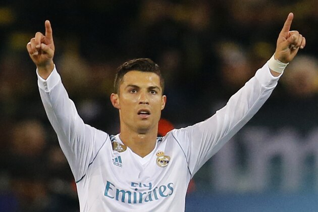 Real Madrid's Cristiano Ronaldo celebrates scoring his side's third goal during a Champions League Group H soccer match between Borussia Dortmund and Real Madrid at the BVB stadium in Dortmund, Germany, Tuesday, Sept. 26, 2017. (AP Photo/Michael Probst)