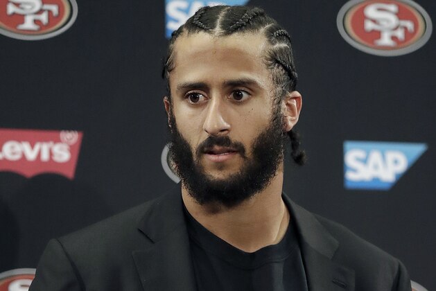 FILE - This Jan. 1, 2017, file photo shows then San Francisco 49ers quarterback Colin Kaepernick speaking at a news conference after the team's NFL football game against the Seattle Seahawks in Santa Clara, Calif. NFL spokesman Joe Lockhart says the league expects Colin Kaepernick to be invited to the next meeting between owners and players to discuss social justice initiatives. Lockhart adds that the meeting probably will take place next week. (AP Photo/Marcio Jose Sanchez, File)