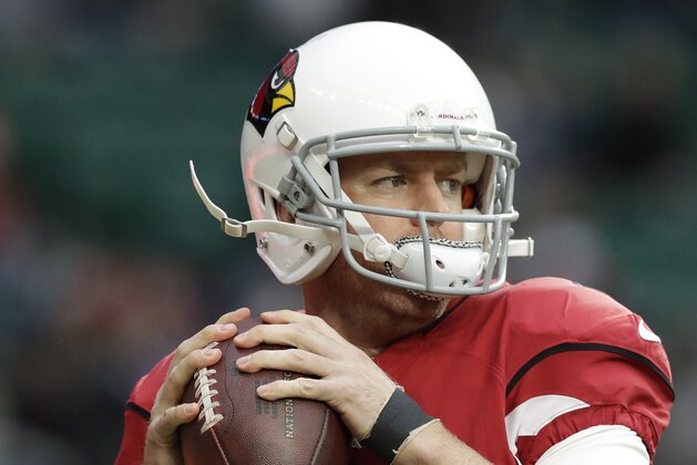 Arizona Cardinals quarterback Carson Palmer (3) warms up before an NFL football game against Los Angeles Rams at Twickenham Stadium in London, Sunday Oct. 22, 2017. (AP Photo/Matt Dunham)