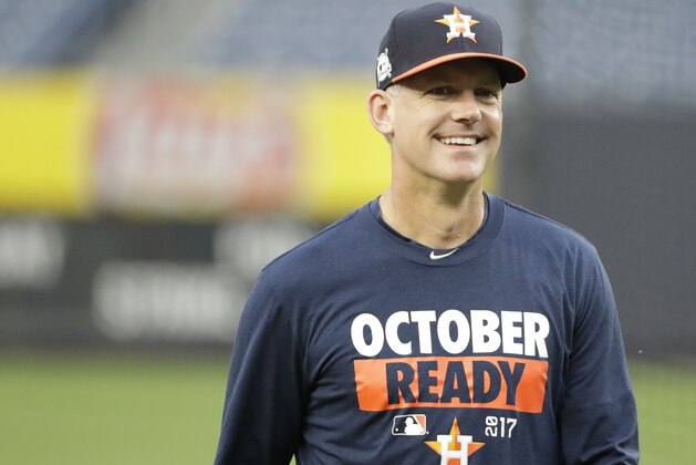 Houston Astros manager A.J. Hinch smiles during a practice session at Yankee Stadium for Game 3 of the American League Championship Series baseball game against the New York Yankees Sunday, Oct. 15, 2017, in New York. (AP Photo/David J. Phillip)