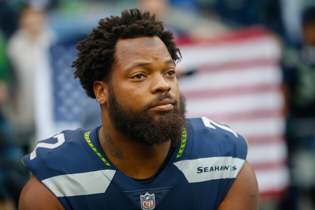 SEATTLE, WA - OCTOBER 1: Defensive end Michael Bennett #72 of the Seattle Seahawks sits on the bench during the national anthem before the game against the Indianapolis Colts at CenturyLink Field on October 1, 2017 in Seattle, Washington. (Photo by Otto Greule Jr /Getty Images)