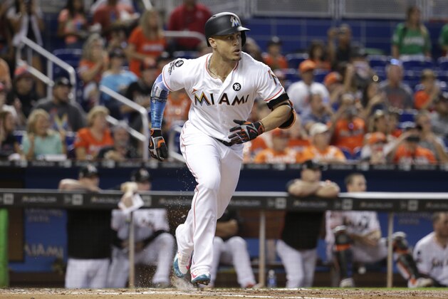 Miami Marlins' Giancarlo Stanton runs after hitting a single during the first inning of a baseball game against the Atlanta Braves, Sunday, Oct. 1, 2017, in Miami. (AP Photo/Lynne Sladky)
