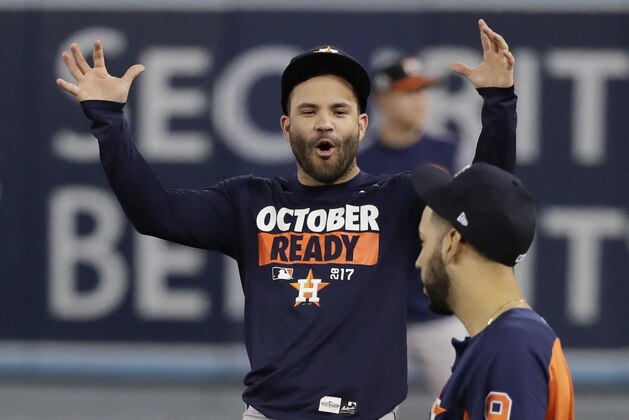 Houston Astros second baseman Jose Altuve, left, talks with left fielder Marwin Gonzalez during batting practice for baseball's World Series against the Los Angeles Dodgers, Monday, Oct. 23, 2017, in Los Angeles. (AP Photo/David J. Phillip)