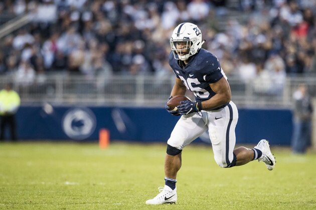 UNIVERSITY PARK, PA - SEPTEMBER 30:  Saquon Barkley #26 of the Penn State Nittany Lions runs with the ball prior to throwing a touchdown pass during the second half against the Indiana Hoosiers on September 30, 2017 at Beaver Stadium in University Park, Pennsylvania. Penn State defeats Indiana 45-14.  (Photo by Brett Carlsen/Getty Images)