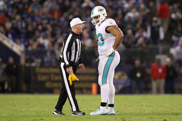 BALTIMORE, MD - OCTOBER 26: Defensive Tackle Ndamukong Suh #93 of the Miami Dolphins talks with referee John Parry after a play in the third quarter against the Baltimore Ravens at M&T Bank Stadium on October 26, 2017 in Baltimore, Maryland. (Photo by Rob Carr/Getty Images)