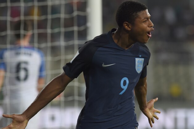 Rhian Brewster of England celebrates after scoring the second goal during the quarterfinal football match between USA and England in the FIFA U-17 World Cup at the Jawaharlal Nehru Stadium in Goa on October 21, 2017. / AFP PHOTO / INDRANIL MUKHERJEE        (Photo credit should read INDRANIL MUKHERJEE/AFP/Getty Images)