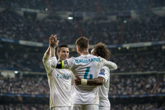 MADRID, SPAIN - SEPTEMBER 13: Sergio Ramos (c) of Real Madrid celebrates with teammates Marcelo Vieira Da Silva (r) and Cristiano Ronaldo during the UEFA Champions League 2017-18 match between Real Madrid and APOEL FC at Estadio Santiago Bernabeu on 13 September 2017 in Madrid, Spain. (Photo by Power Sport Images/Getty Images)