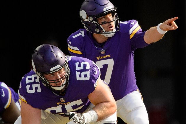 MINNEAPOLIS, MN - OCTOBER 22: Case Keenum #7 of the Minnesota Vikings calls a play at the line of scrimmage as teammate Pat Elflein #65 waits to snap the ball against the Baltimore Ravens during the game on October 22, 2017 at US Bank Stadium in Minneapolis, Minnesota. (Photo by Hannah Foslien/Getty Images)