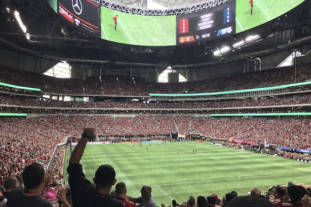 In this Oct. 22, 2017 photo, the crowd cheers as Atlanta United goal takes on Toronto FC in an MLS soccer match in Atlanta. Welcome to Atlanta, soccer's newest hotbed, which amazingly enough has sprouted up in a city known for its fickle sports fans and plenty of heartbreak from its teams.  (AP Photo/Paul Newberry)