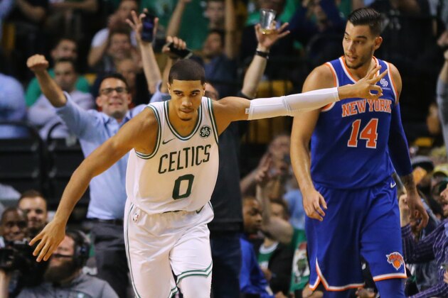 BOSTON, MA - OCTOBER 24: Jayson Tatum #0 of the Boston Celtics reacts in front of Willy Hernangomez #14 of the New York Knicks after hitting a three point shot during the fourth quarter at TD Garden on October 24, 2017 in Boston, Massachusetts. The Celtics defeat the Knicks 110-89. (Photo by Maddie Meyer/Getty Images)