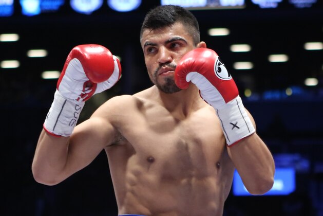 Victor Ortiz in action with Luis Collazo, not pictured, during their WBA international welterweight title fight in Brooklyn, Thursday, Jan. 30, 2014. Collazo won via KO in the second round.  (AP Photo/Julia Weeks)