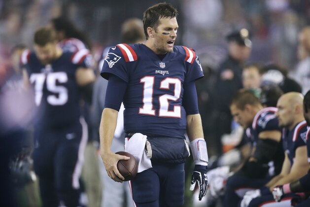 New England Patriots quarterback Tom Brady talks to teammates on the sideline during the second half of an NFL football game against the Atlanta Falcons, Sunday, Oct. 22, 2017, in Foxborough, Mass. (AP Photo/Charles Krupa)
