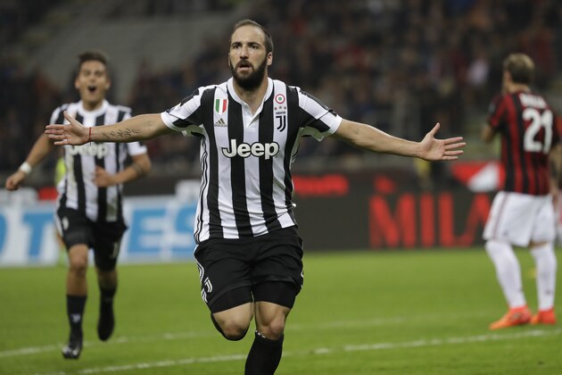 Juventus' Gonzalo Higuain celebrates scoring his side's first goal during a Serie A soccer match between AC Milan and Juventus, at the Milan San Siro stadium, Italy, Saturday, Oct. 28, 2017. (AP Photo/Luca Bruno)