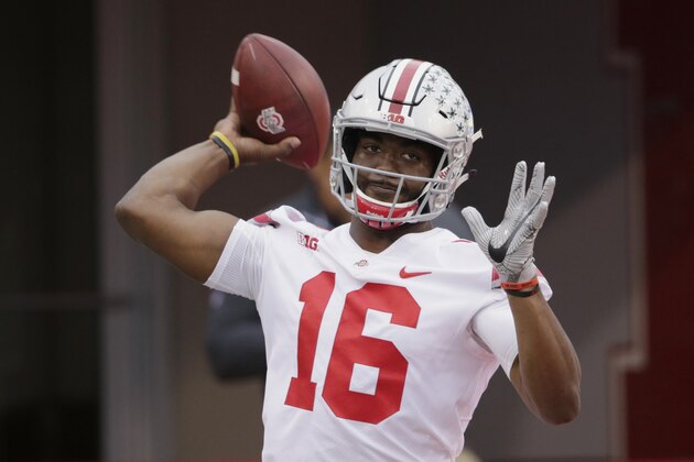 Ohio State quarterback J.T. Barrett (16) throws during warmups before an NCAA college football game against Nebraska in Lincoln, Neb., Saturday, Oct. 14, 2017. (AP Photo/Nati Harnik)