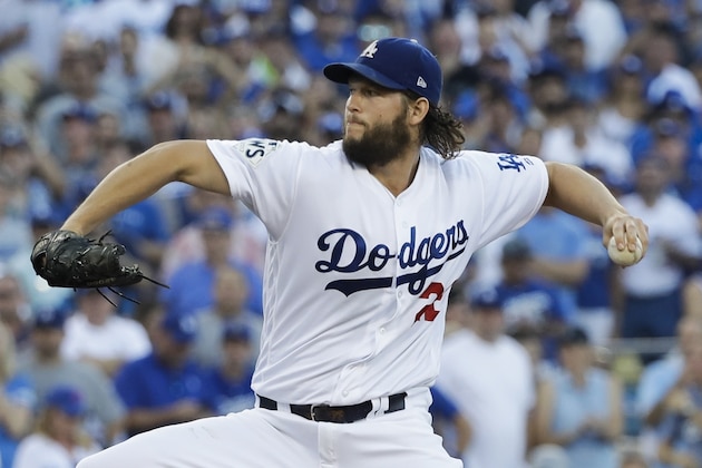 Los Angeles Dodgers starting pitcher Clayton Kershaw throws during the first inning of Game 1 of baseball's World Series against the Houston Astros Tuesday, Oct. 24, 2017, in Los Angeles. (AP Photo/David J. Phillip)