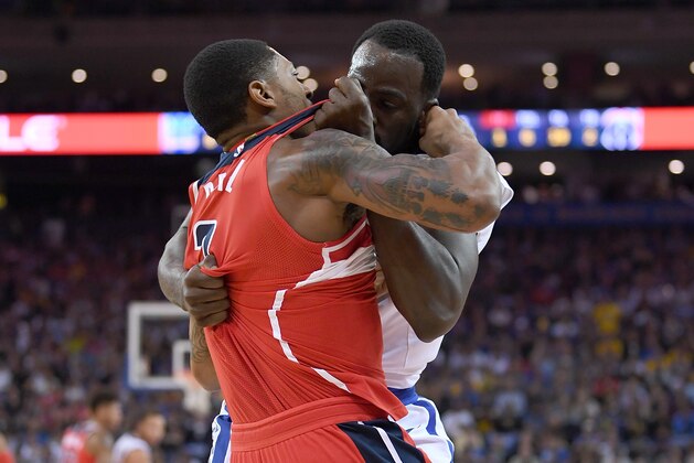 OAKLAND, CA - OCTOBER 27:  Draymond Green #23 of the Golden State Warriors and Bradley Beal #3 of the Washington Wizards gets tangled up in a fight during the second quarter of their NBA basketball game at ORACLE Arena on October 27, 2017 in Oakland, California. NOTE TO USER: User expressly acknowledges and agrees that, by downloading and or using this photograph, User is consenting to the terms and conditions of the Getty Images License Agreement. (Photo by Thearon W. Henderson/Getty Images)