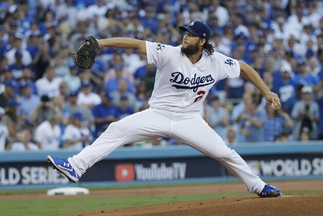 Los Angeles Dodgers starting pitcher Clayton Kershaw throws during the first inning of Game 1 of baseball's World Series against the Houston Astros Tuesday, Oct. 24, 2017, in Los Angeles. (AP Photo/David J. Phillip)