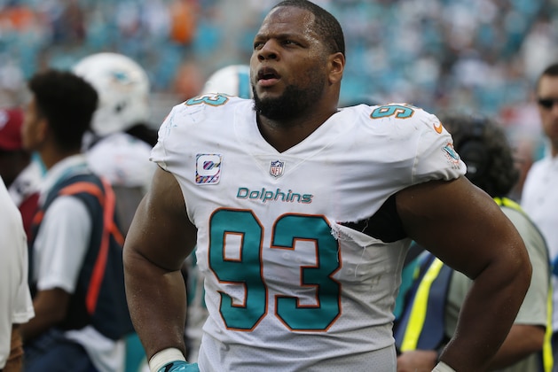 Miami Dolphins defensive tackle Ndamukong Suh (93) looks up from the sidelines, during the second half of an NFL football game against the Tennessee Titans, Sunday, Oct. 8, 2017, in Miami Gardens, Fla. (AP Photo/Wilfredo Lee)