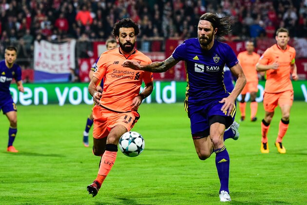 Liverpool's Egyptian forward Mohamed Salah (L) fights for the ball with NK Maribor's Slovenian defender Marko Suler during the UEFA Champions League group E football match between NK Maribor and Liverpool at the Ljudski vrt Stadium, in Maribor, on October 17, 2017. 
 / AFP PHOTO / Jure Makovec        (Photo credit should read JURE MAKOVEC/AFP/Getty Images)