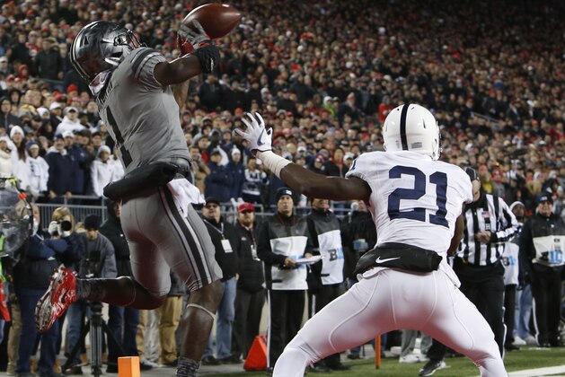 Ohio State receiver Johnnie Dixon, left, catches a touchdown in front of Penn State defensive back Amani Oruwariye during the second half of an NCAA college football game Saturday, Oct. 28, 2017, in Columbus, Ohio. Ohio State beat Penn State 39-38. (AP Photo/Jay LaPrete)