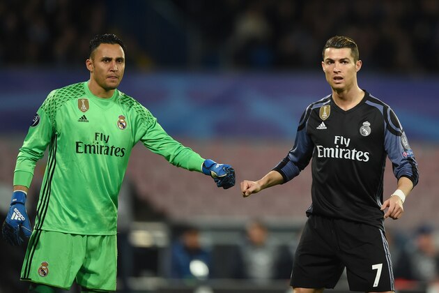 Real Madrid's Costa Rican goalkeeper Keylor Navas and Real Madrid's Portuguese forward Cristiano Ronaldo (R) during the UEFA Champions League football match SSC Napoli vs Real Madrid on March 7, 2017 at the San Paolo stadium in Naples. / AFP PHOTO / Filippo MONTEFORTE        (Photo credit should read FILIPPO MONTEFORTE/AFP/Getty Images)