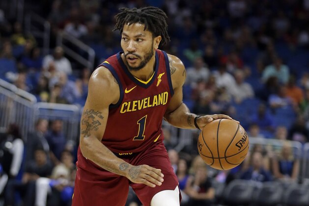 Cleveland Cavaliers' Derrick Rose moves the ball against the Orlando Magic during the first half of an NBA preseason basketball game, Friday, Oct. 13, 2017, in Orlando, Fla. (AP Photo/John Raoux)