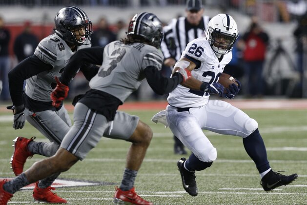 Penn State running back Saquon Barkley, right, cuts up field against Ohio State during the second half of an NCAA college football game, Saturday, Oct. 28, 2017, in Columbus, Ohio. Ohio State defeated Penn State 39-38. (AP Photo/Jay LaPrete)