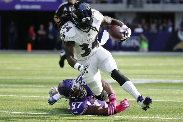 Baltimore Ravens running back Alex Collins (34) is tackled by Minnesota Vikings defensive end Everson Griffen (97) during the first half of an NFL football game, Sunday, Oct. 22, 2017, in Minneapolis. (AP Photo/Bruce Kluckhohn)