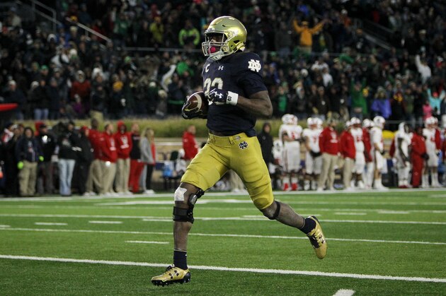 SOUTH BEND, IN - OCTOBER 28:  Josh Adams #33 of the Notre Dame Fighting Irish score a touchdown in the third quarter against the North Carolina State Wolfpack at Notre Dame Stadium on October 28, 2017 in South Bend, Indiana. (Photo by Dylan Buell/Getty Images)