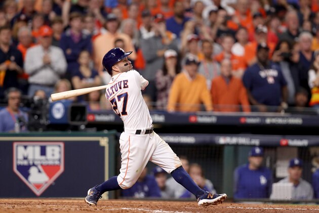 HOUSTON, TX - OCTOBER 29:  Jose Altuve #27 of the Houston Astros hits a three-run home run during the fifth inning against the Los Angeles Dodgers in game five of the 2017 World Series at Minute Maid Park on October 29, 2017 in Houston, Texas.  (Photo by Christian Petersen/Getty Images)